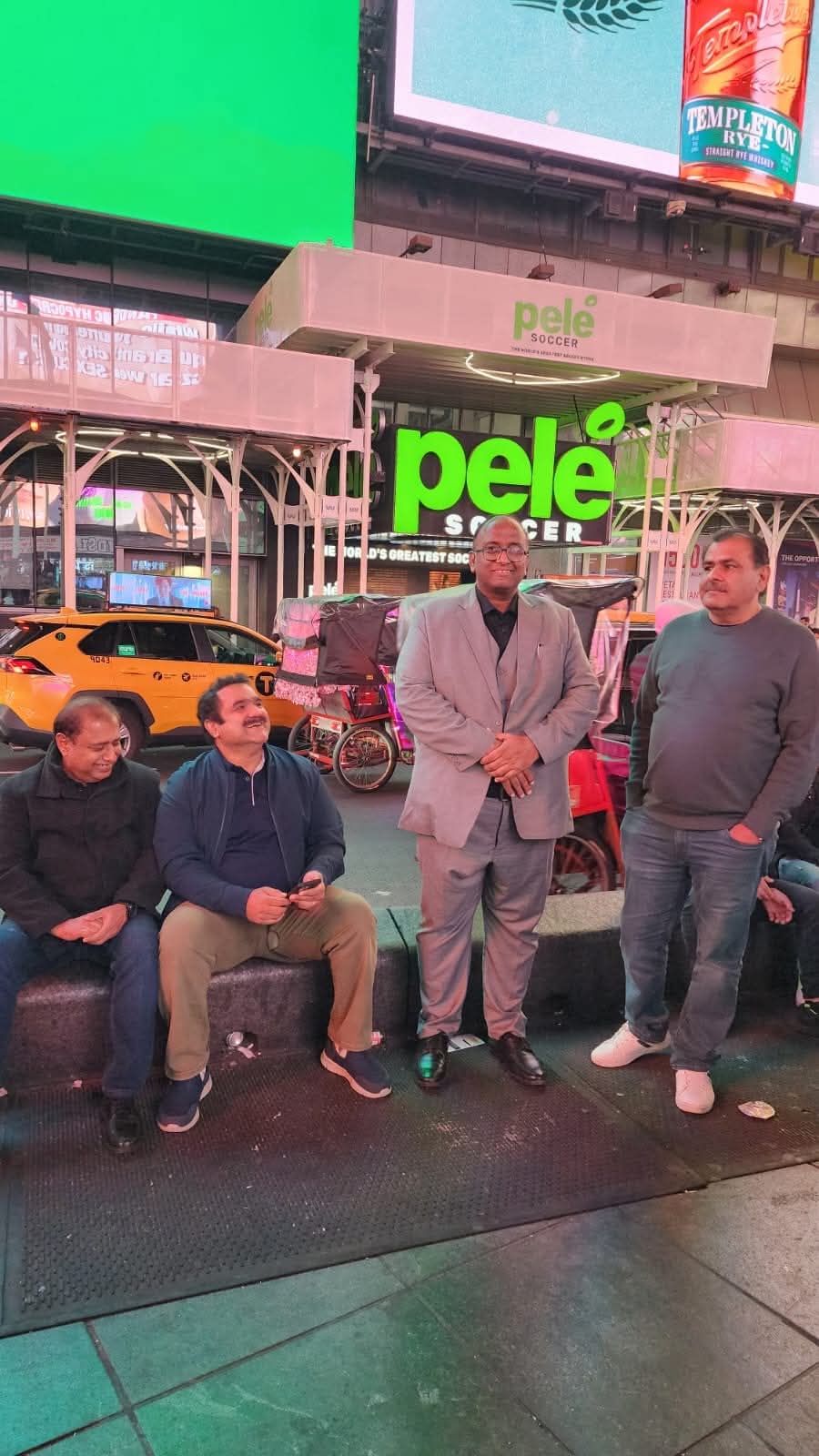 Ghulam Shabbir Babar with colleagues in Times Square, New York